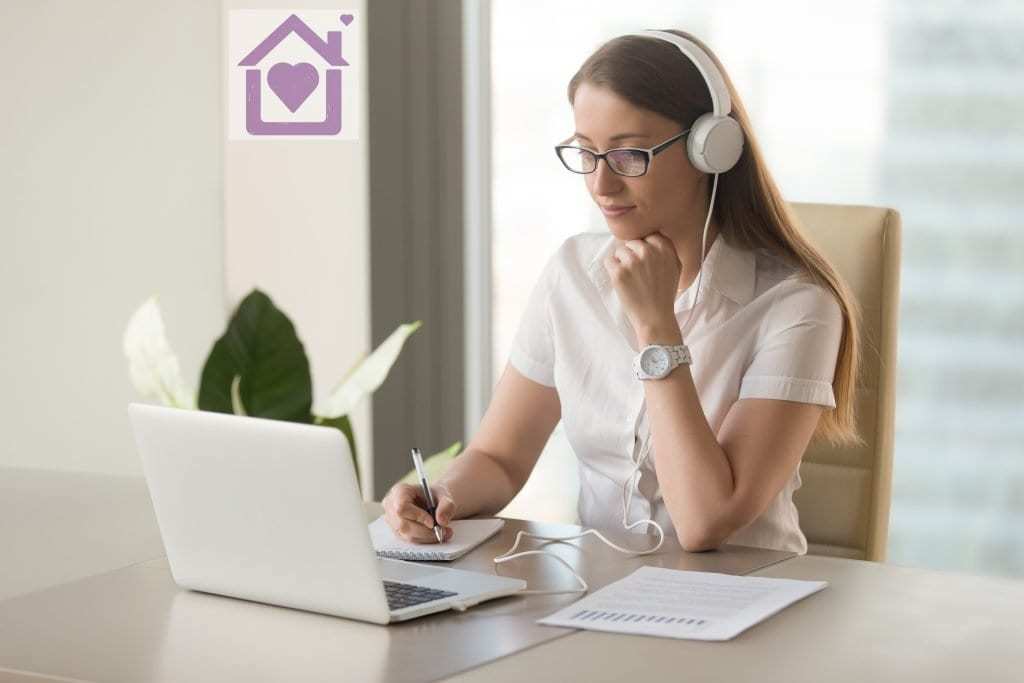 Woman working at home while listening Woman working at home while listening
