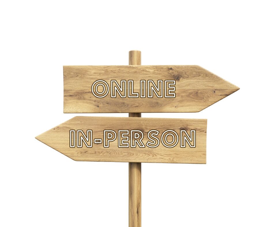 Sign posts representing therapy options at the Purple House Clinic: Left=in-person therapy; right = online therapy
