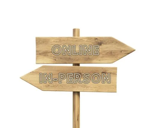 Sign posts representing therapy options at the Purple House Clinic: Left=in-person therapy; right = online therapy